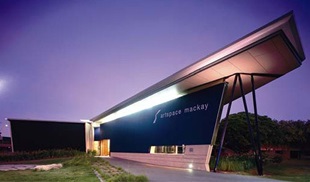 Roofing made from LYSAGHT KLIP-LOK® in colour Windspray® made from COLORBOND® steel on the Artspace Mackay, a regional art gallery and museum operated by Mackay City Council. Walling panes are made from LYSAGHT SPANDEK® in colour Night Sky®.